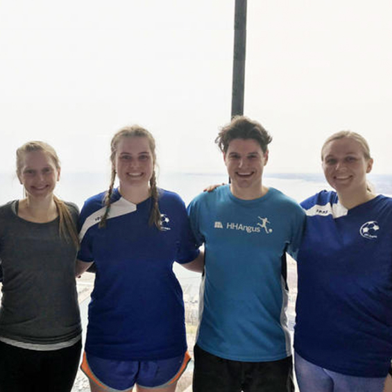 Four employees at the CV Tower Climb.