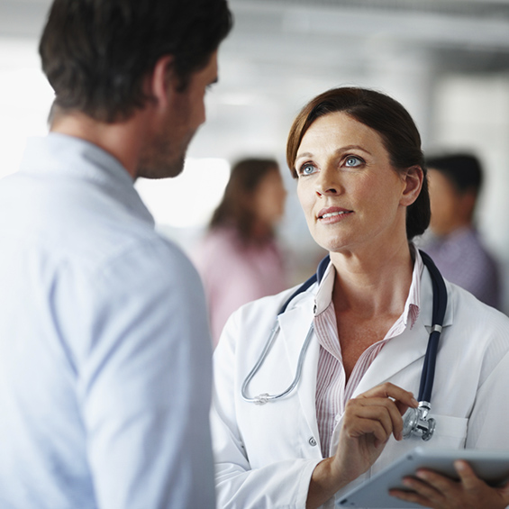 A male client discussing the procedure with a female medical