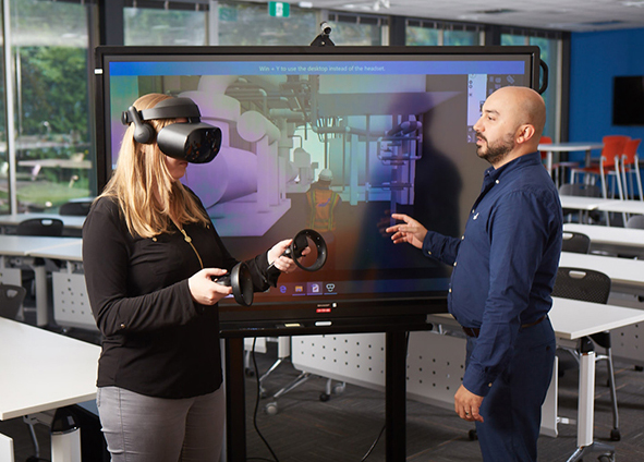 BIM specialists, Melissa Parry and Steve Yilmaz using Virtual Reality Modeling Software Application