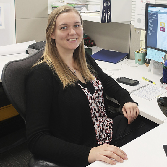 Melissa Parry sitting at her desk.