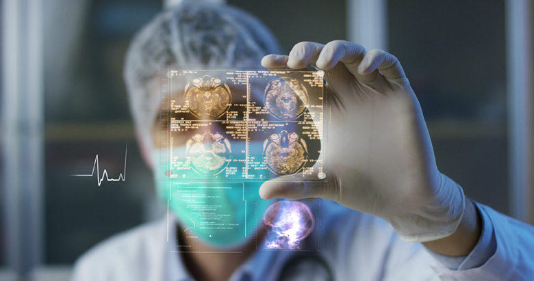 A physician, surgeon, examines a technological digital holograph