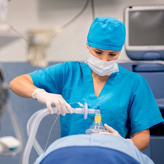 Nurse giving a patient oxygen.