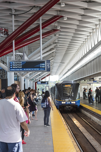 One People waiting at the Platform of Commercial Broadway Station