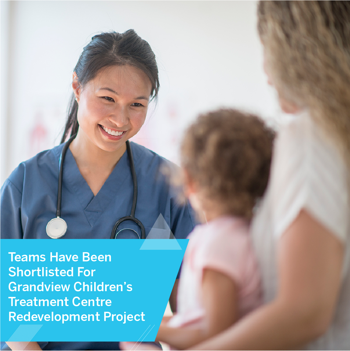 Doctor smiling at child and parent