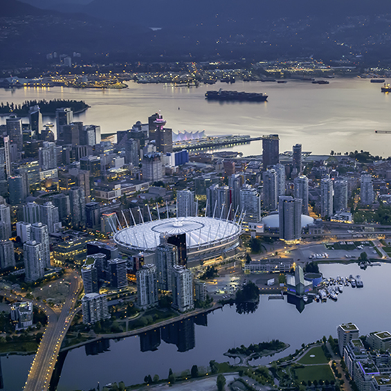 Exterior of BC Place and Science World with modern cityscape and harbour, Vancouver, British, Columbia, Canada.