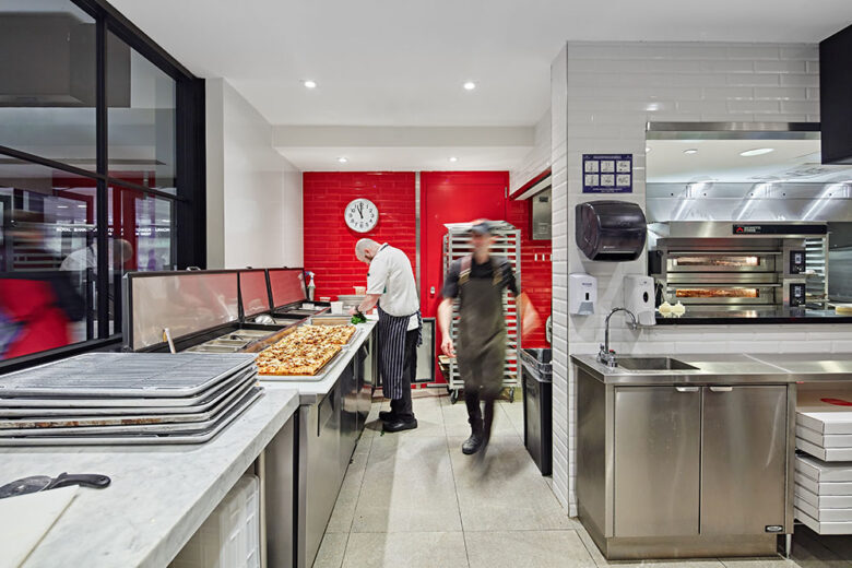 010A6672 Interior of Fabbrica kitchen with prepared pizza