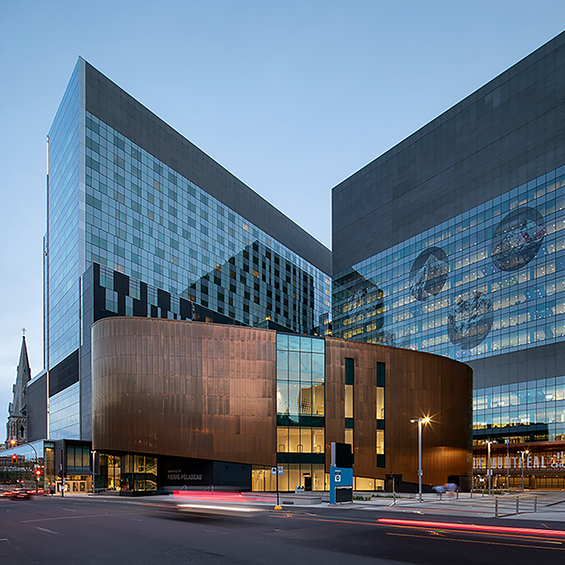 Exterior photo of CHUM hospital complex and Amphithéâtre Pierre-Péladeau in Montreal