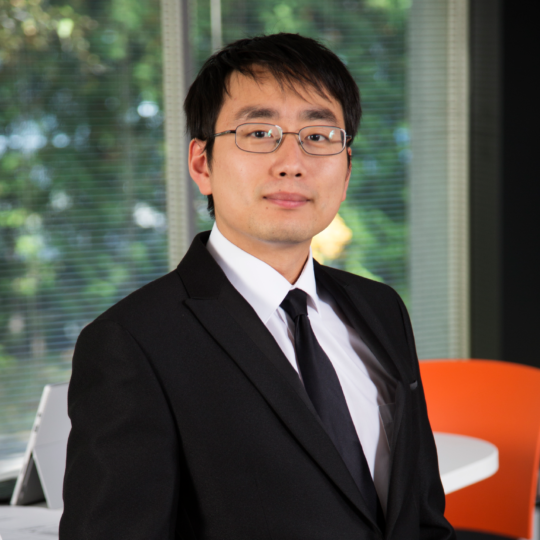 TimZhu A young engineer standing in a suit