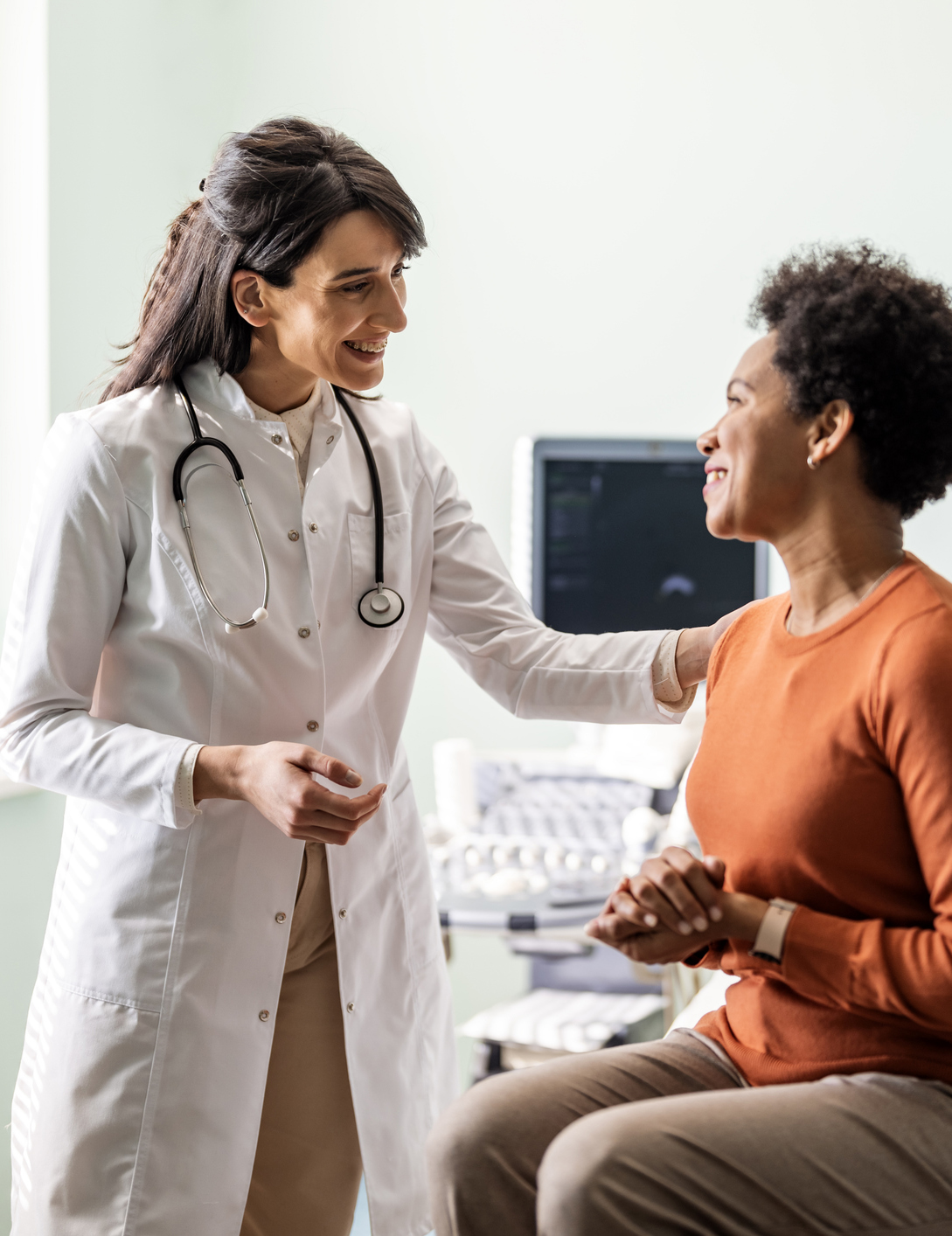 Female medical practitioner reassuring a patient Female medical practitioner reassuring a patient