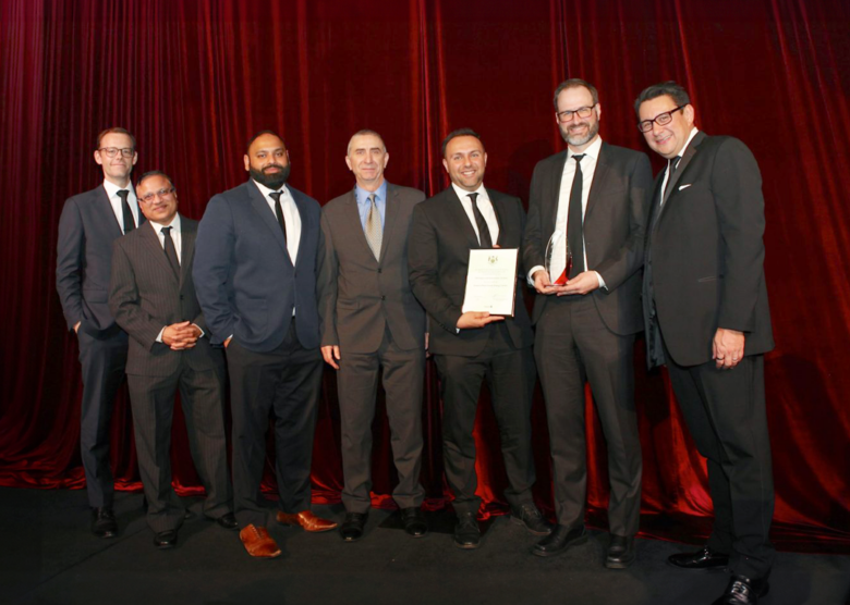 PSEC_1080X1080_1 Image of HHA team accepting award on stage