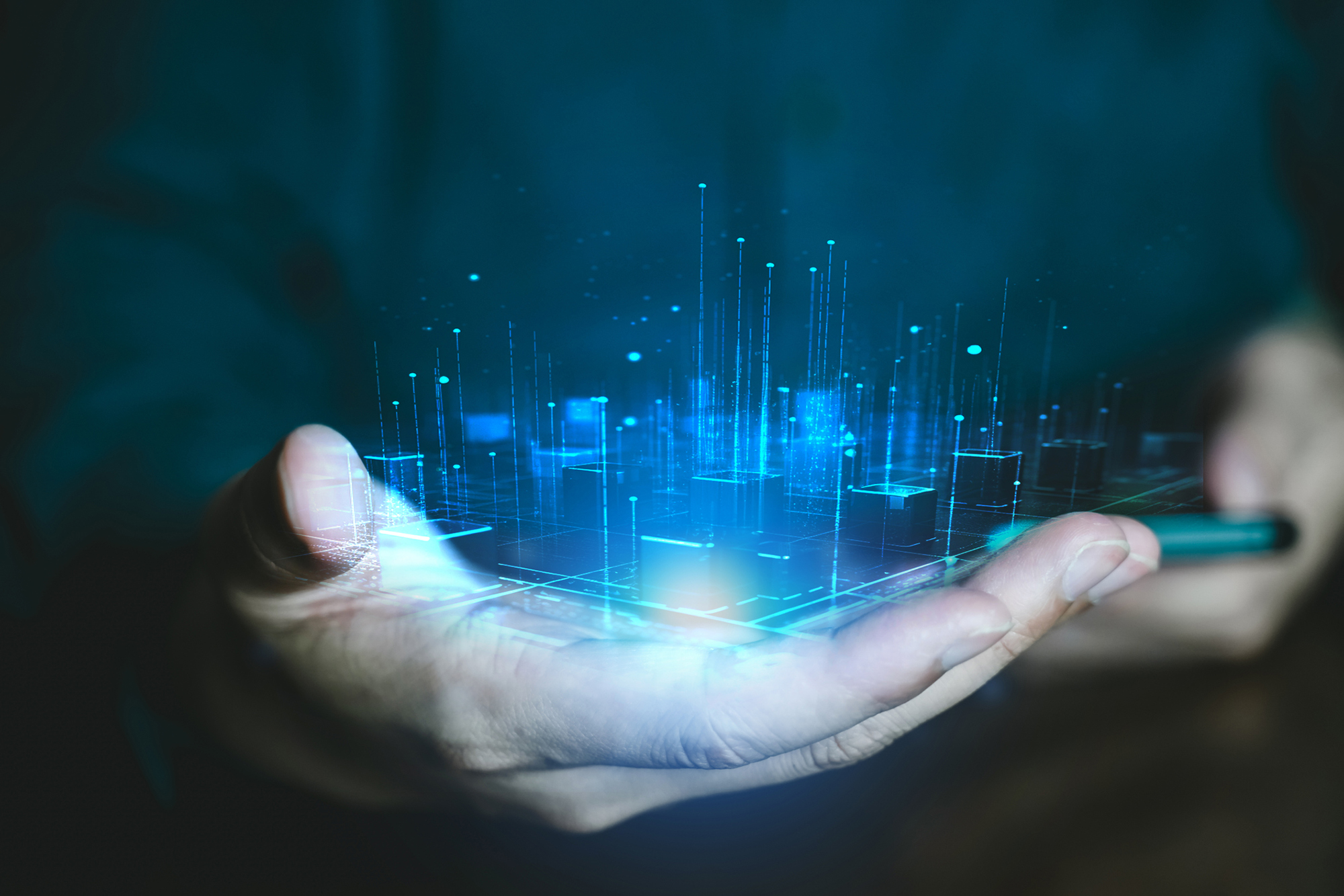 Image of open hand holding abstract building technology graphics