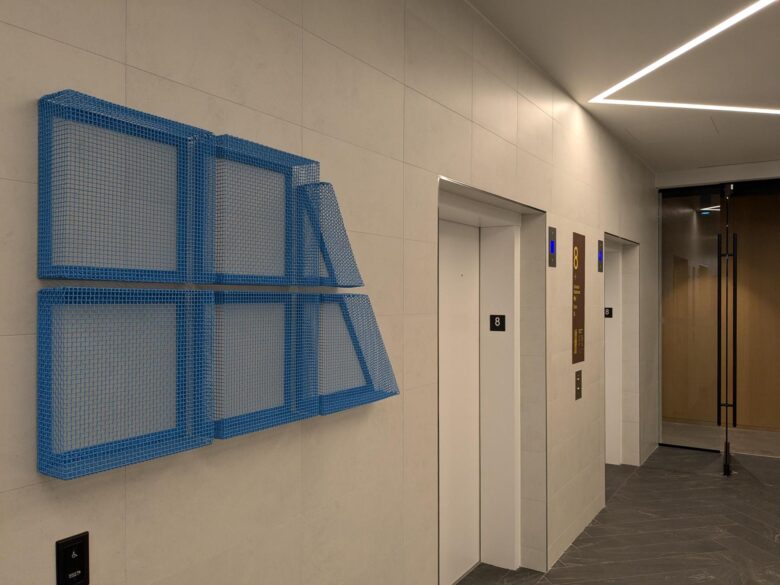 Image of HHA Toronto office entrance sign near elevator doors
