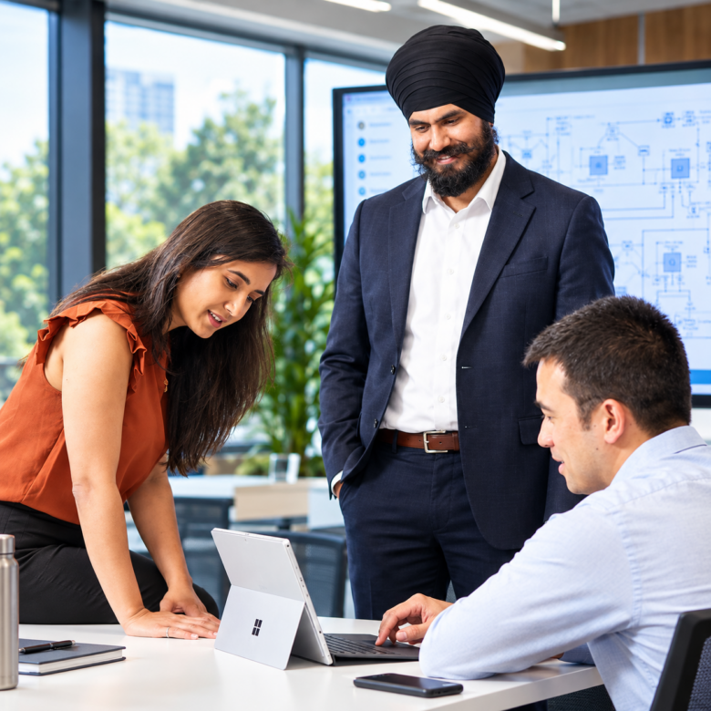 Collaborative Tech Meeting in a Modern Office